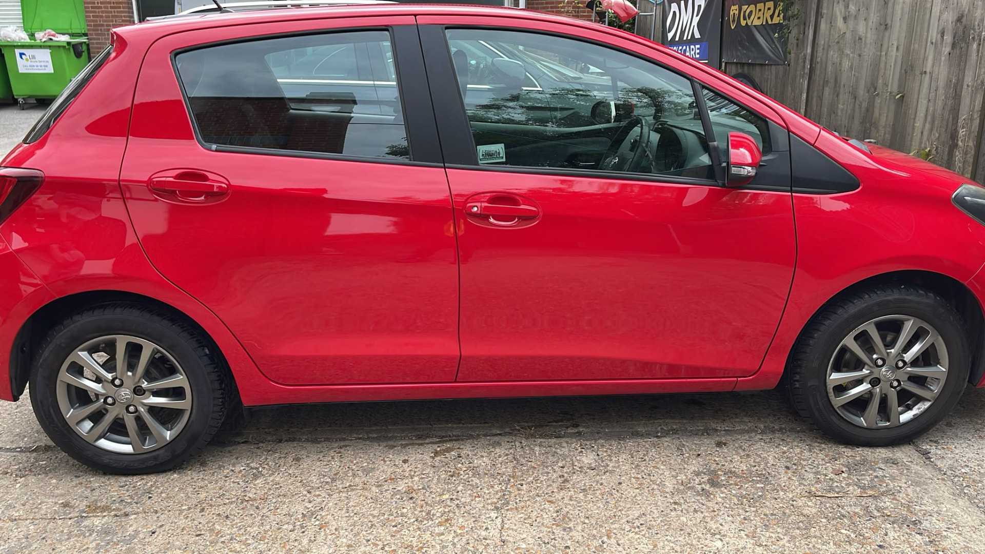 Red car after completed bodywork and paint repair